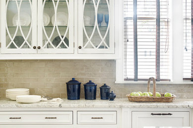 Inspiration for a timeless l-shaped kitchen remodel in Other with beaded inset cabinets, white cabinets, granite countertops, beige backsplash, porcelain backsplash, paneled appliances, an island and beige countertops
