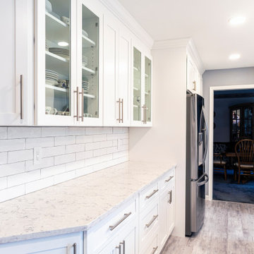 Elegant white kitchen with grey island
