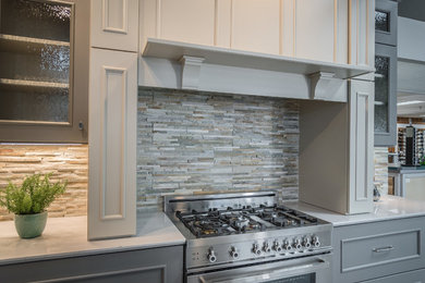 Example of a trendy kitchen design in Louisville with multicolored backsplash, stone tile backsplash and stainless steel appliances