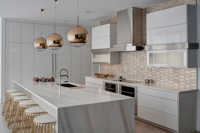 This is an example of a large contemporary l-shaped kitchen/diner in Chicago with a submerged sink, flat-panel cabinets, white cabinets, metallic splashback, stainless steel appliances, an island, marble worktops, terracotta splashback and light hardwood flooring.