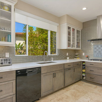 Encinitas Kitchen Remodel Featuring Starmark Marshmallow Cream Glass Front Upper