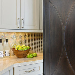 Photo of a mid-sized transitional l-shaped open plan kitchen in San Diego with an undermount sink, recessed-panel cabinets, beige cabinets, limestone benchtops, beige splashback, glass tile splashback, stainless steel appliances, travertine floors and with island.