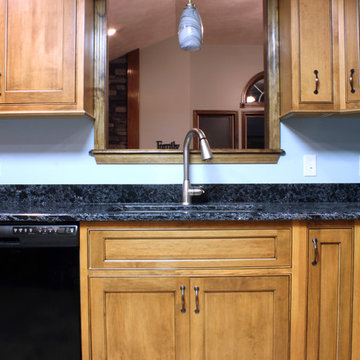 Enclosed Transitional Maple Kitchen with Black Glaze