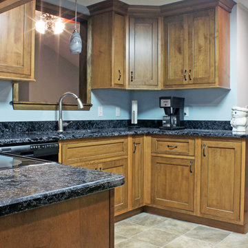 Enclosed Transitional Maple Kitchen with Black Glaze