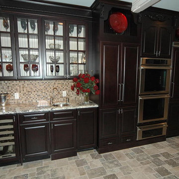 Espresso kitchen cabinets with red accents