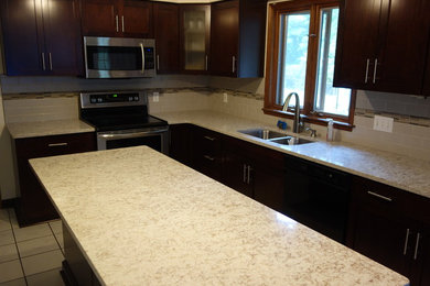 Example of a trendy kitchen design in New York with shaker cabinets