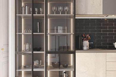 Ejemplo de cocina minimalista grande con armarios con paneles lisos