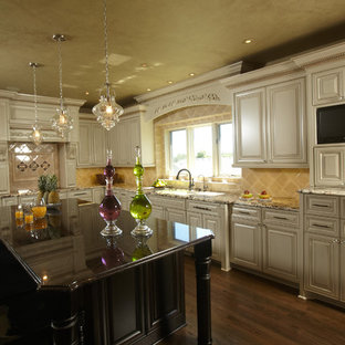 Inspiration for a timeless kitchen remodel in Minneapolis with raised-panel cabinets, beige cabinets and beige backsplash