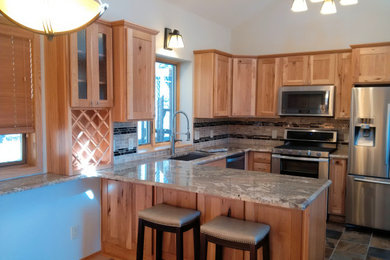 Small u-shaped slate floor and multicolored floor eat-in kitchen photo in Other with an undermount sink, shaker cabinets, light wood cabinets, granite countertops, multicolored backsplash, ceramic backsplash, stainless steel appliances, an island and multicolored countertops