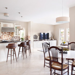 Large transitional open concept kitchen ideas - Open concept kitchen - large transitional marble floor open concept kitchen idea in Miami with raised-panel cabinets, white cabinets, multicolored backsplash, an island, an undermount sink, granite countertops, stone tile backsplash and stainless steel appliances