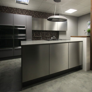 Mid-sized modern eat-in kitchen ideas - Inspiration for a mid-sized modern single-wall linoleum floor and gray floor eat-in kitchen remodel in Cheshire with a drop-in sink, flat-panel cabinets, gray cabinets, quartzite countertops, brown backsplash, brick backsplash, paneled appliances, an island and gray countertops