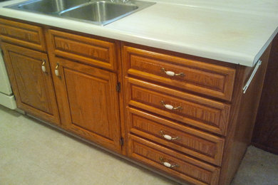 Example of a mid-sized classic galley eat-in kitchen design in Dallas with raised-panel cabinets