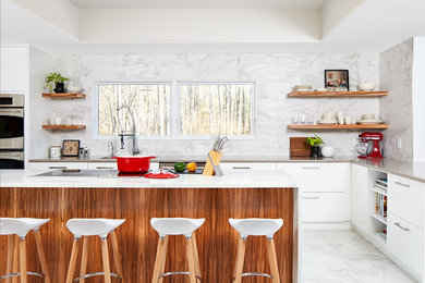 Trendy l-shaped white floor kitchen photo in DC Metro with an undermount sink, flat-panel cabinets, white cabinets, white backsplash, stainless steel appliances and an island