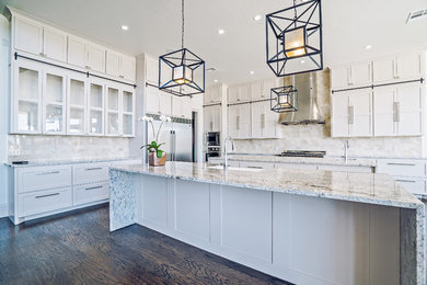 Inspiration for a huge contemporary dark wood floor open concept kitchen remodel in Oklahoma City with a farmhouse sink, flat-panel cabinets, white cabinets, granite countertops, white backsplash, mosaic tile backsplash, stainless steel appliances and two islands