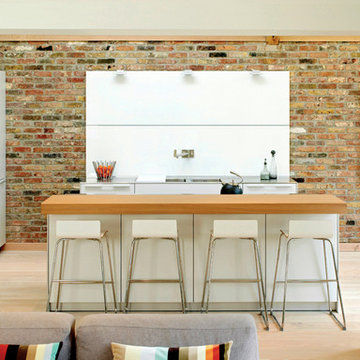 Exposed brickwork with a bulthaup b3 kitchen