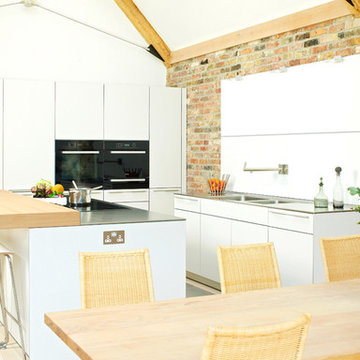 Exposed brickwork with a bulthaup b3 kitchen