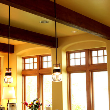 Exposed Wood Beams on Kitchen Ceiling with Yellow Walls and Ceiling