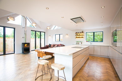 Photo of a medium sized contemporary l-shaped open plan kitchen in West Midlands.