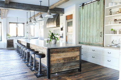 Inspiration for a huge farmhouse l-shaped dark wood floor and brown floor eat-in kitchen remodel in Vancouver with an undermount sink, stainless steel appliances, an island, shaker cabinets, white cabinets, subway tile backsplash, quartz countertops and white backsplash