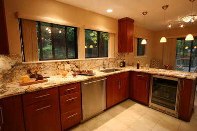 Eat-in kitchen - large traditional u-shaped ceramic tile and beige floor eat-in kitchen idea in New York with an undermount sink, granite countertops, stone slab backsplash, stainless steel appliances, flat-panel cabinets, medium tone wood cabinets, brown backsplash, a peninsula and brown countertops