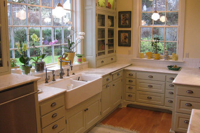 Inspiration for a mid-sized cottage light wood floor eat-in kitchen remodel in Portland with a farmhouse sink, raised-panel cabinets, blue cabinets, marble countertops, white backsplash, subway tile backsplash and an island