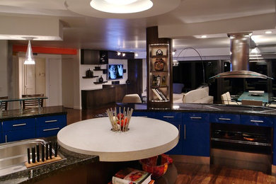 Inspiration for a contemporary u-shaped medium tone wood floor eat-in kitchen remodel in Miami with blue cabinets, granite countertops, stainless steel appliances and an island