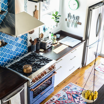 Fare Isle: Eclectic Kitchen with Blue Tile Backsplash