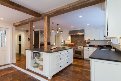 Photo of a large farmhouse u-shaped kitchen/diner in Boston with recessed-panel cabinets and an island.