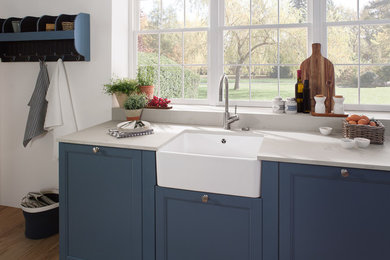 Design ideas for a farmhouse kitchen in London with a belfast sink.
