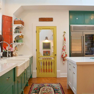 Kitchen - country light wood floor kitchen idea in Los Angeles with a farmhouse sink, shaker cabinets, green cabinets, quartz countertops, stainless steel appliances and an island