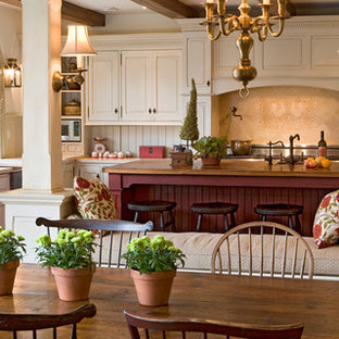 Farmhouse eat-in kitchen photos - Eat-in kitchen - country eat-in kitchen idea in Philadelphia with raised-panel cabinets and white cabinets