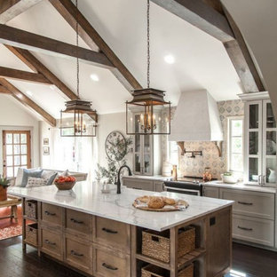Large farmhouse open concept kitchen ideas - Open concept kitchen - large farmhouse single-wall dark wood floor and brown floor open concept kitchen idea in Columbus with a farmhouse sink, shaker cabinets, medium tone wood cabinets, marble countertops, multicolored backsplash, stainless steel appliances, an island and white countertops