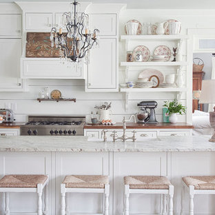 Farmhouse kitchen pictures - Inspiration for a cottage kitchen remodel in Atlanta with white cabinets and wood countertops