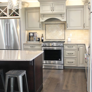 Farmhouse kitchen Taupe Painted Cabinets,Quartz Tops, and Dark Island