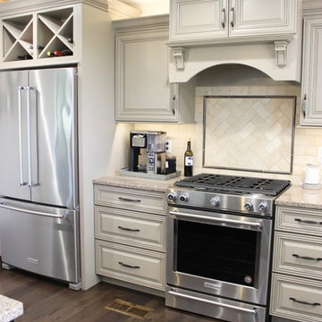Farmhouse kitchen Taupe Painted Cabinets,Quartz Tops, and Dark Island
