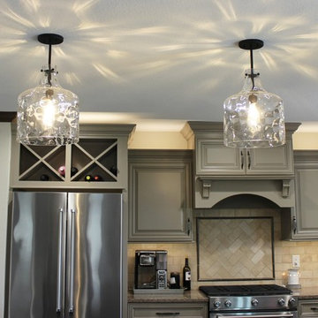 Farmhouse kitchen Taupe Painted Cabinets,Quartz Tops, and Dark Island