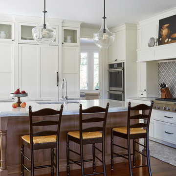Farmhouse Kitchen with Brown Island and White Perimeter Cabinets