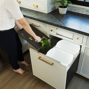 Mid-sized farmhouse open concept kitchen pictures - Inspiration for a mid-sized cottage u-shaped light wood floor and brown floor open concept kitchen remodel in New York with an undermount sink, shaker cabinets, gray cabinets, granite countertops, gray backsplash, mosaic tile backsplash, colored appliances and an island