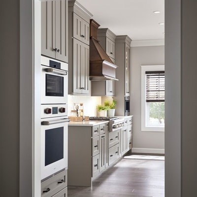 Inspiration for a large farmhouse l-shaped eat-in kitchen remodel in Other with shaker cabinets, gray cabinets and an island
