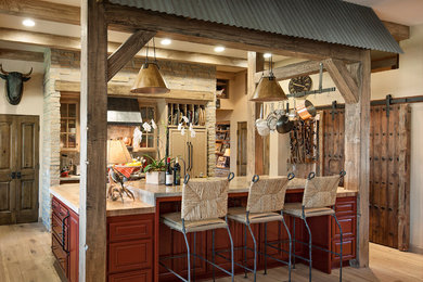 Inspiration for a mid-sized southwestern galley medium tone wood floor kitchen remodel in Santa Barbara with beaded inset cabinets, stone tile backsplash, paneled appliances, an island and medium tone wood cabinets