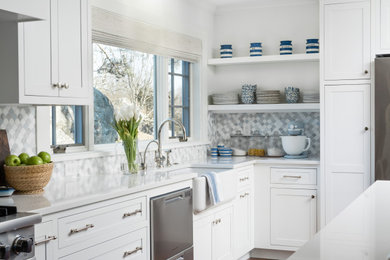 Inspiration for a large coastal l-shaped dark wood floor and brown floor eat-in kitchen remodel in Providence with a farmhouse sink, shaker cabinets, white cabinets, gray backsplash, ceramic backsplash, stainless steel appliances, an island and turquoise countertops