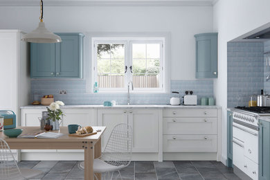 Inspiration for a medium sized farmhouse l-shaped kitchen/diner in Manchester with shaker cabinets, white cabinets, blue splashback, metro tiled splashback, no island, a built-in sink, marble worktops, ceramic flooring and white appliances.