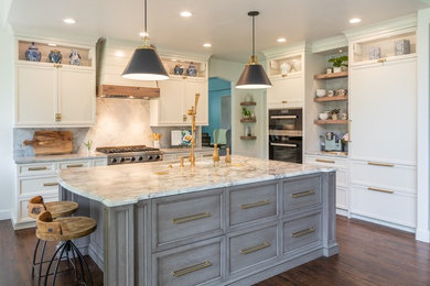 Large transitional l-shaped medium tone wood floor and brown floor eat-in kitchen photo in Denver with an undermount sink, flat-panel cabinets, gray cabinets, marble countertops, white backsplash, marble backsplash, paneled appliances, an island and white countertops
