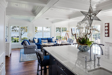 Large beach style u-shaped medium tone wood floor eat-in kitchen photo in Boston with an island, an undermount sink, shaker cabinets, blue cabinets, marble countertops and stainless steel appliances