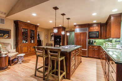 Kitchen - large transitional l-shaped medium tone wood floor kitchen idea in Denver