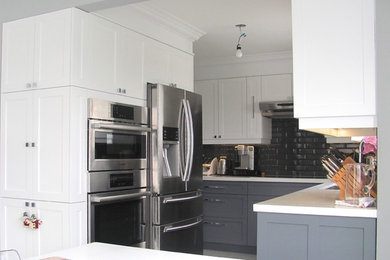 Small elegant l-shaped eat-in kitchen photo in Toronto with shaker cabinets, gray cabinets, gray backsplash, subway tile backsplash, stainless steel appliances, an island and an undermount sink