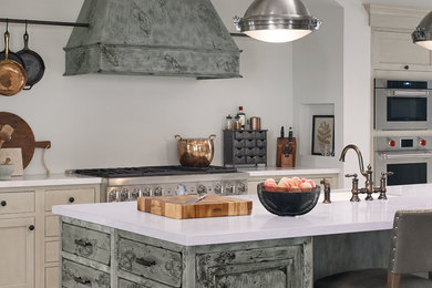 Huge country l-shaped gray floor eat-in kitchen photo in Other with an undermount sink, gray cabinets, stainless steel appliances, two islands and recessed-panel cabinets