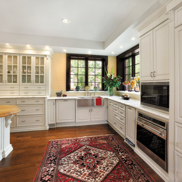 Fieldstone Cabinetry Kitchen and Island with glass front doors