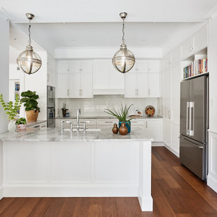 Design ideas for a traditional kitchen in Brisbane with marble benchtops, an integrated sink, shaker cabinets, white cabinets, white splashback, subway tile splashback, medium hardwood floors, with island and multi-coloured benchtop.