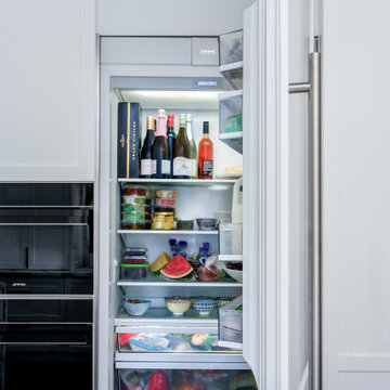 White integrated fridge with silver handles